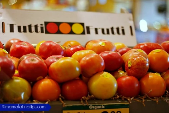 Two rows of tutti frutti farms heirloom tomatoes