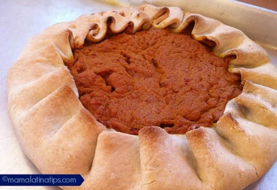 A pumpkin tart on a baking sheet