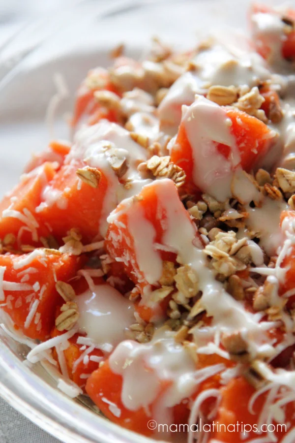 Chopped papaya with granola and cream