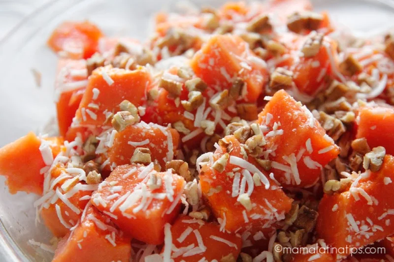 chopped papaya with coconut and chopped pecans.
