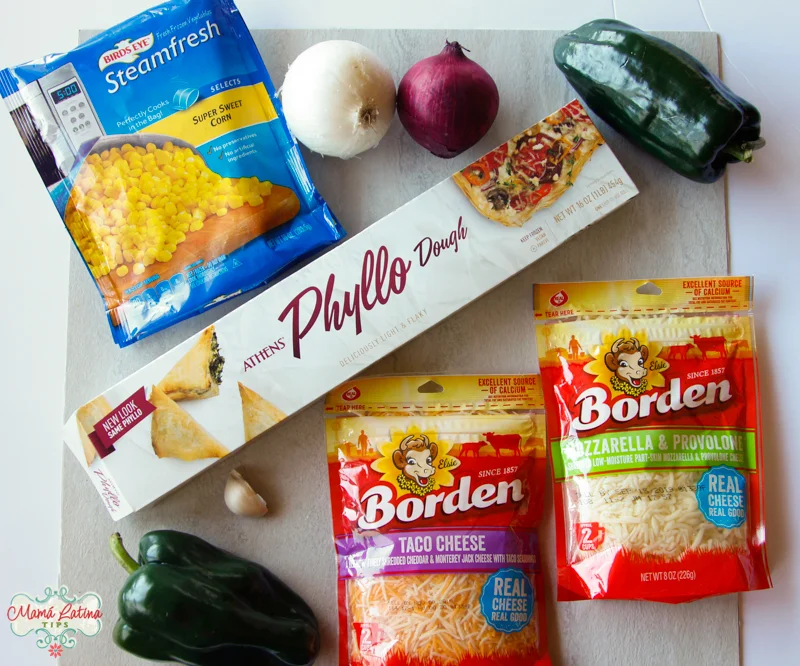 box of Athens Phyllo Dough, bag of birds eye corn, borden cheese and poblano chiles