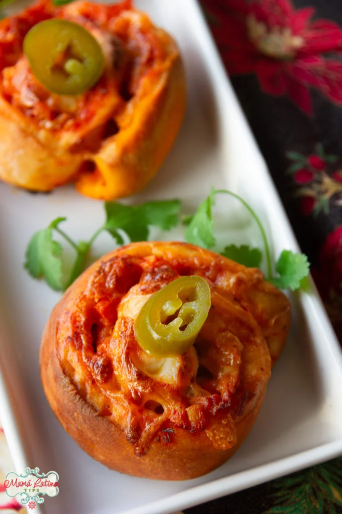 chicken enchilada pinwheels in rectangular white plate